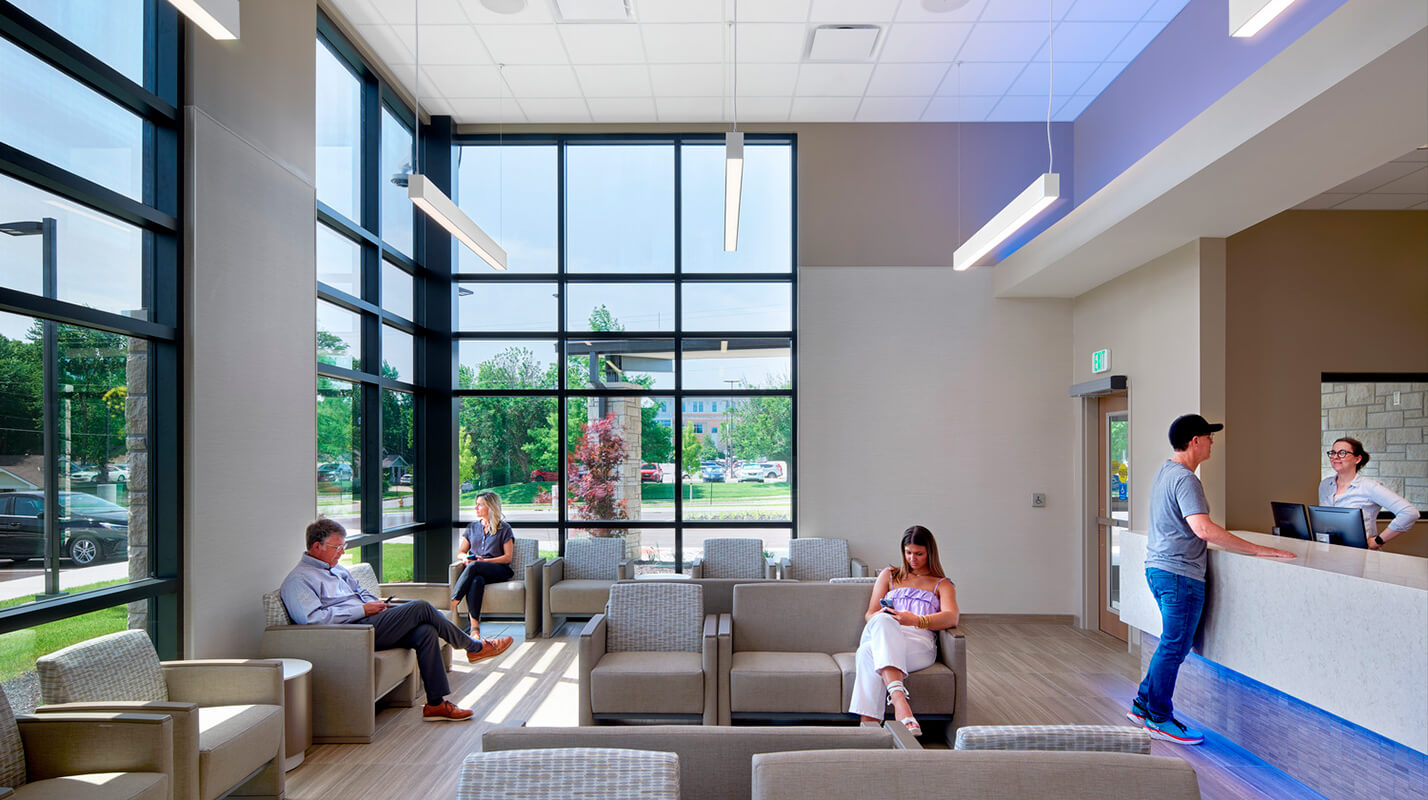 Patients wait in a welcoming lobby area for intake