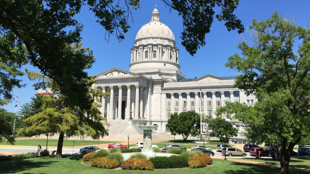 Photo of Missouri State Capitol, a grand building featuring limestone, columns, and a dome.