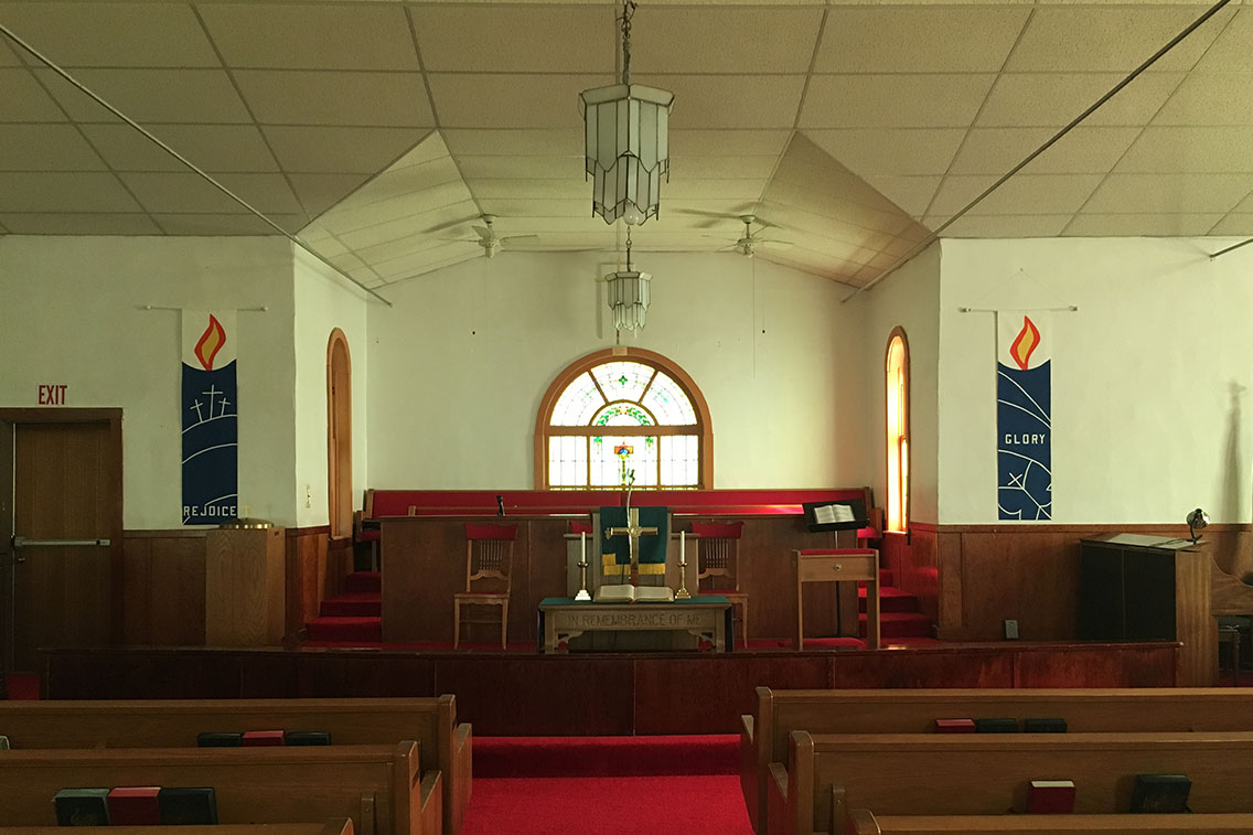 Interior photo of a church sanctuary before it was rehabilitated.