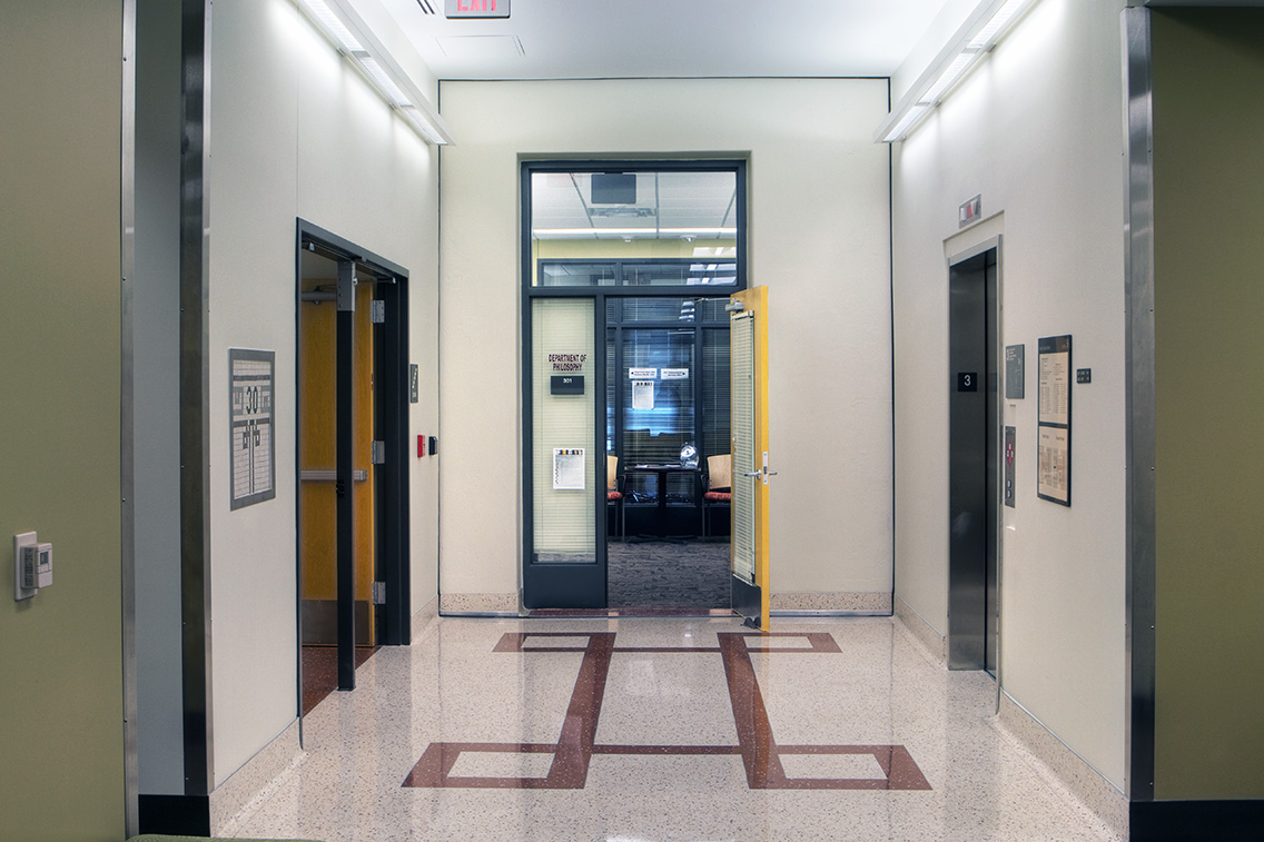 Lobby of rehabilitated YMCA Building with terrazzo floor patterned from historic pool tile