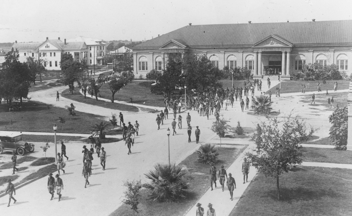 Historic view of cadets walking near Sbisa Dining Hall on Military Walk, Texas A&M